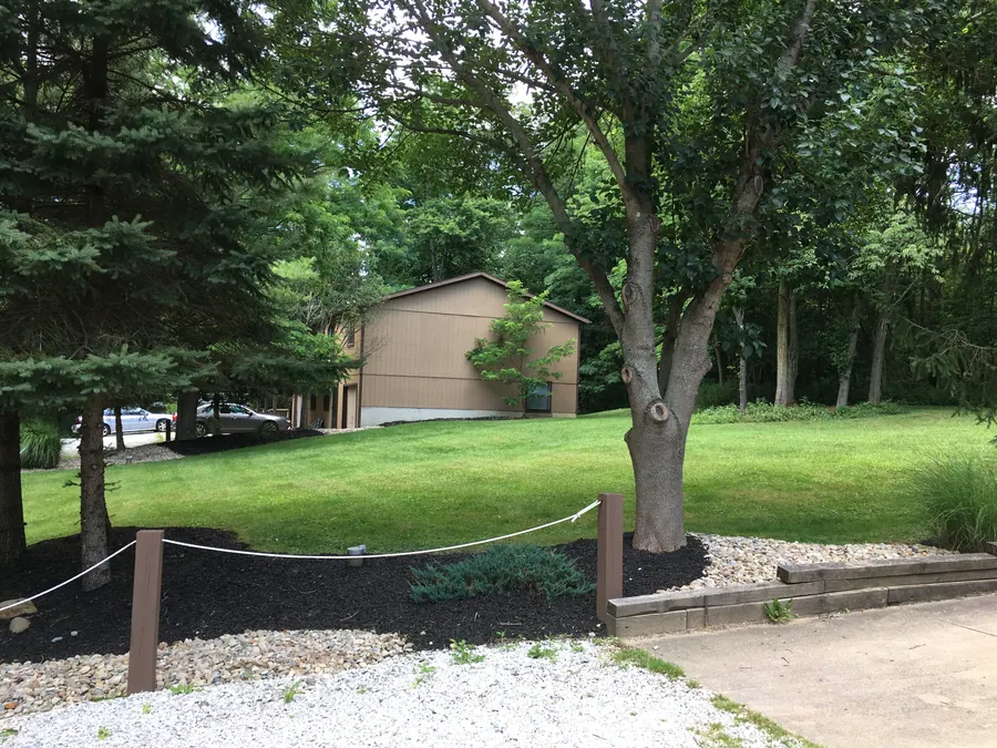 The wooded grounds at Hidden Pines; open Google Maps below for directions